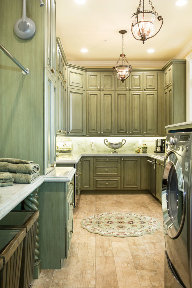 Inspiration for a large u-shaped utility room in Los Angeles with an undermount sink, raised-panel cabinets, green cabinets, marble benchtops, yellow walls, light hardwood floors, a side-by-side washer and dryer, beige floor and white benchtop.
