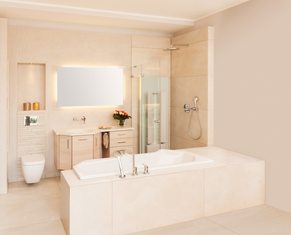 Photo of a small contemporary bathroom in Frankfurt with beige walls, an integrated sink, a hinged shower door, flat-panel cabinets, beige cabinets, a drop-in tub, a curbless shower, a two-piece toilet, beige tile and beige floor.