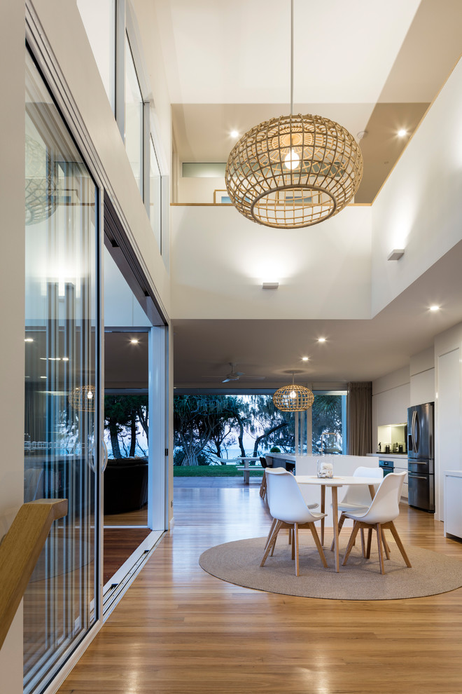 This is an example of a large contemporary dining room in Sunshine Coast.