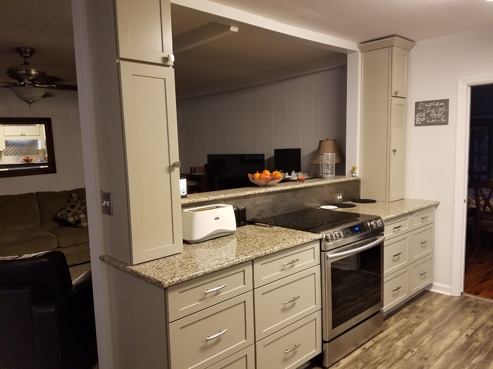 Galley kitchen photo in Charleston with shaker cabinets, beige cabinets, granite countertops and stainless steel appliances