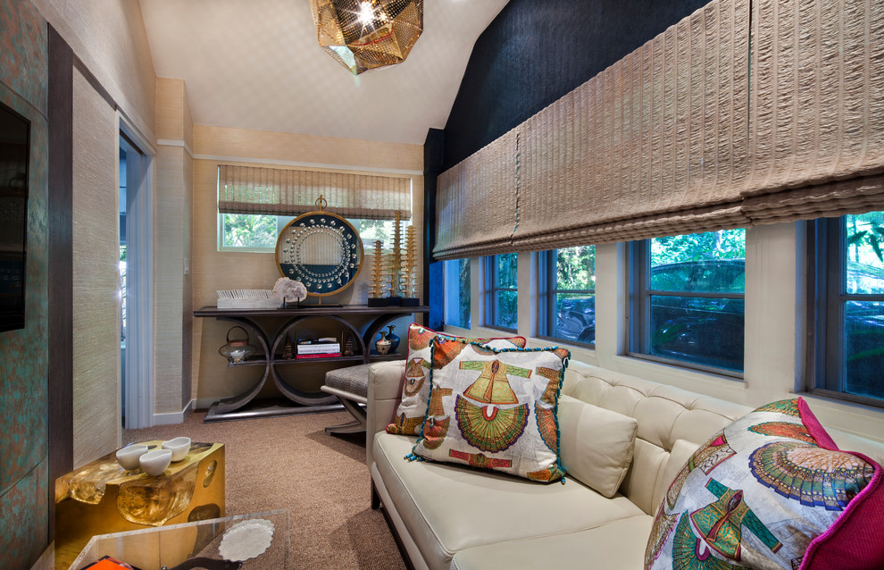 This is an example of a small contemporary enclosed home theatre in Miami with multi-coloured walls, carpet and a wall-mounted tv.