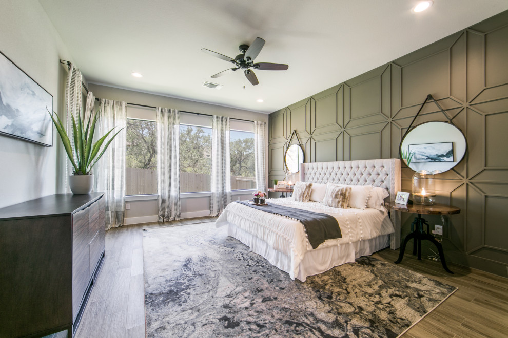 Design ideas for a large classic master bedroom in Dallas with porcelain flooring, multi-coloured floors and panelled walls.