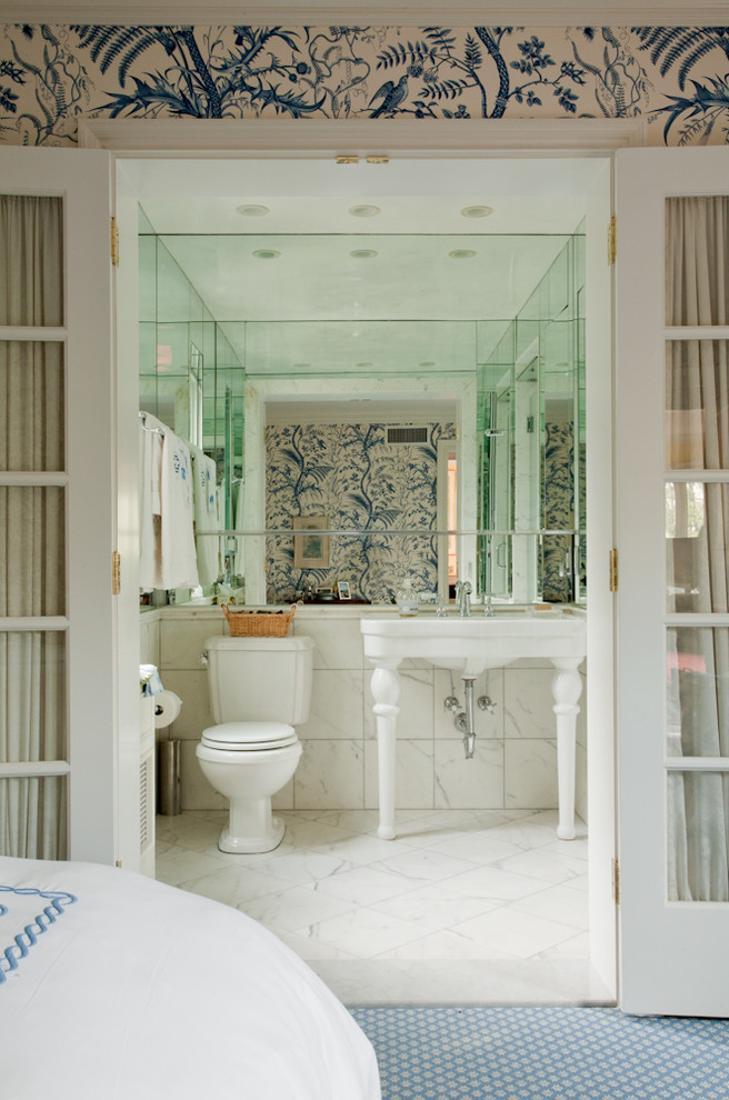 Photo of a beach style bathroom in New York with a console sink, white tile and blue floor.
