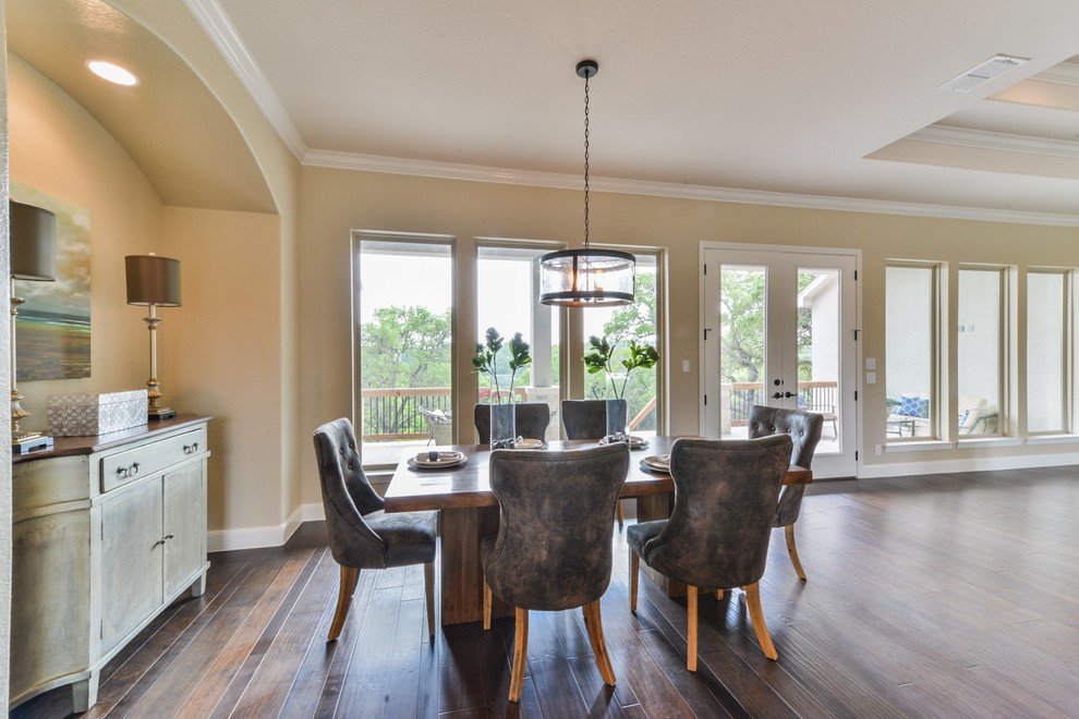Inspiration for a large rustic dark wood floor great room remodel in Austin with beige walls and no fireplace