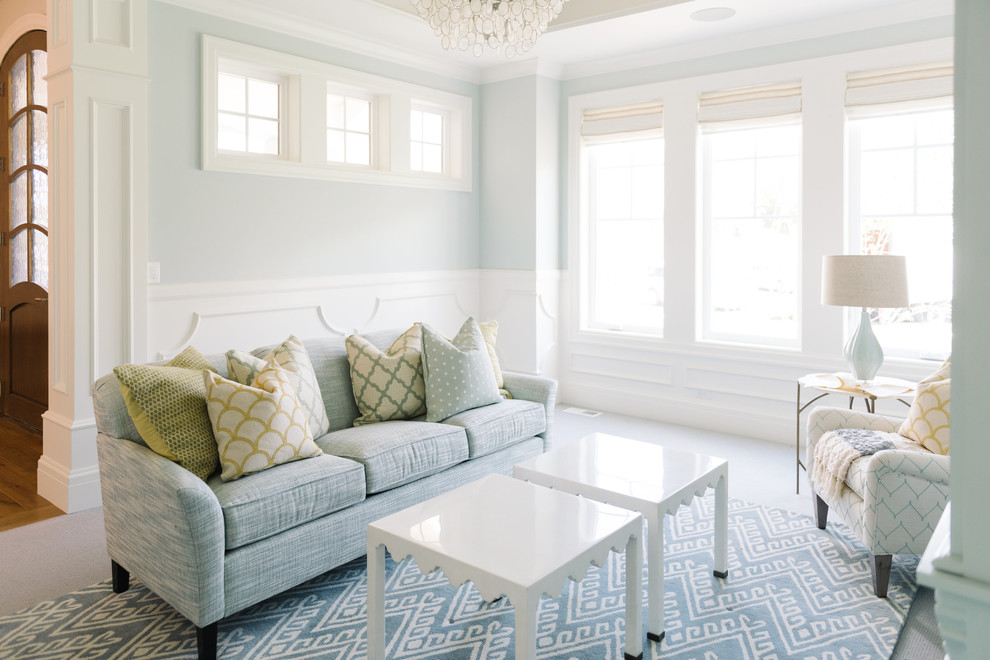 This is an example of a transitional family room in Salt Lake City with white walls and carpet.