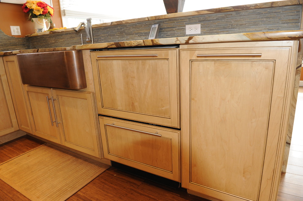 Inspiration for a mid-sized transitional u-shaped light wood floor eat-in kitchen remodel in Baltimore with a farmhouse sink, shaker cabinets, light wood cabinets, onyx countertops, stainless steel appliances and an island