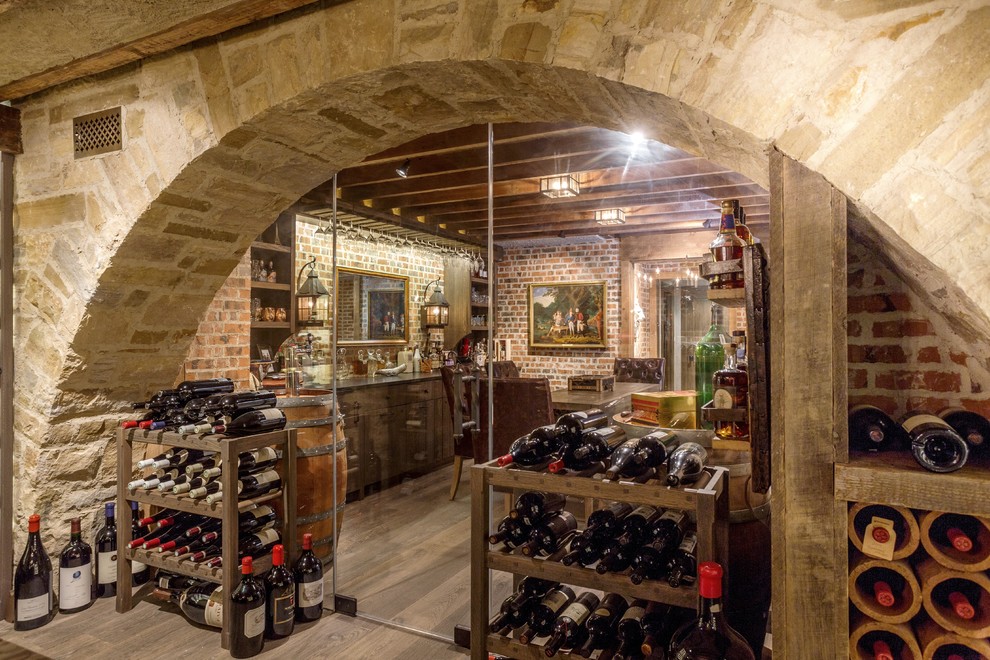 Design ideas for a large country wine cellar in Baltimore with medium hardwood floors and storage racks.