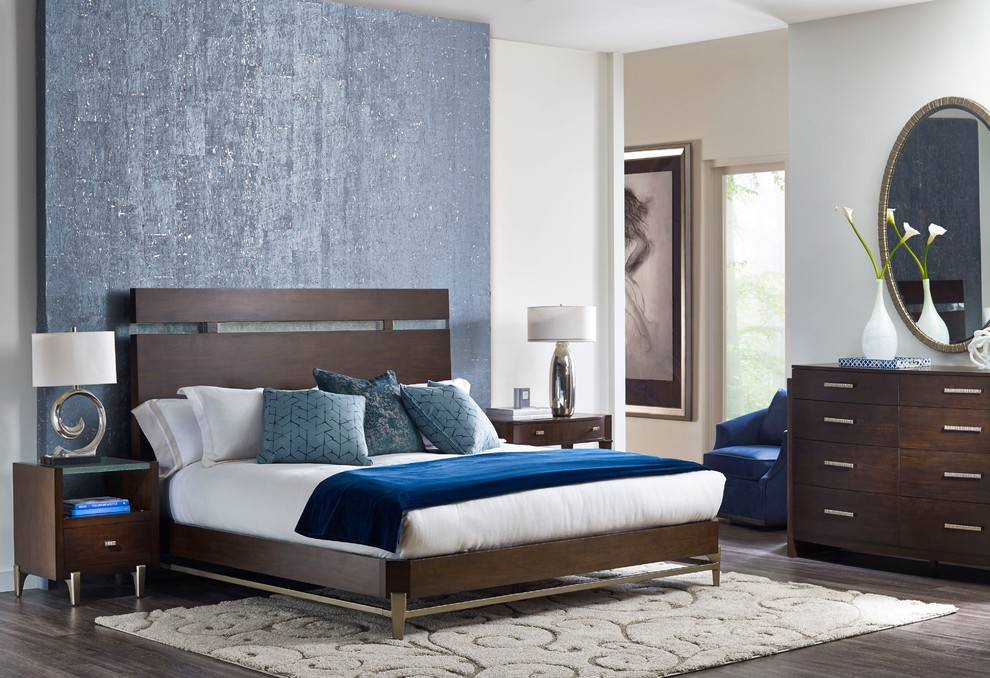 Design ideas for a mid-sized contemporary master bedroom in Milwaukee with white walls and dark hardwood floors.