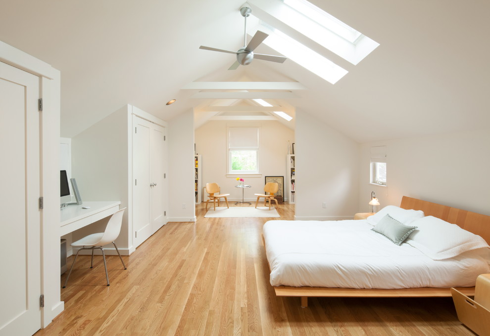 Inspiration for a large contemporary master light wood floor bedroom remodel in Portland with yellow walls