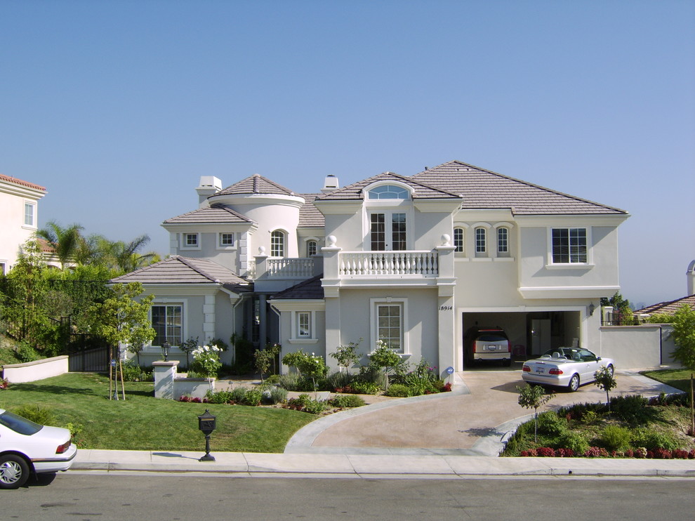 Large traditional two-storey white exterior in Los Angeles.