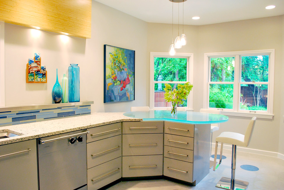 This is an example of a contemporary kitchen in Austin with glass benchtops and turquoise benchtop.