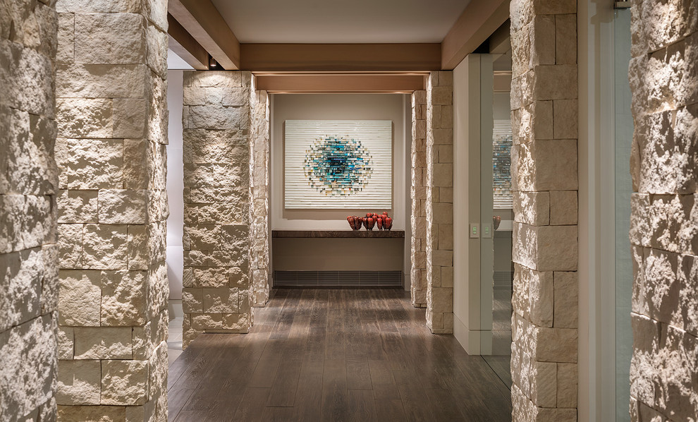 Contemporary hallway in Orange County with beige walls.
