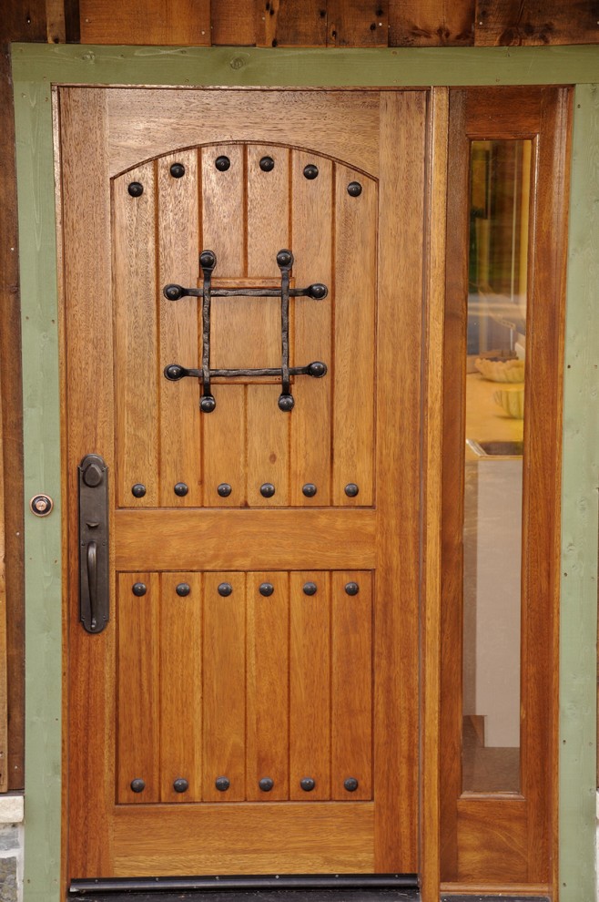 Mountain style front door photo with a brown front door
