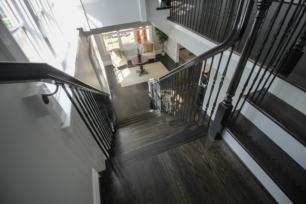 Staircase - large transitional wooden l-shaped mixed material railing staircase idea in DC Metro with painted risers
