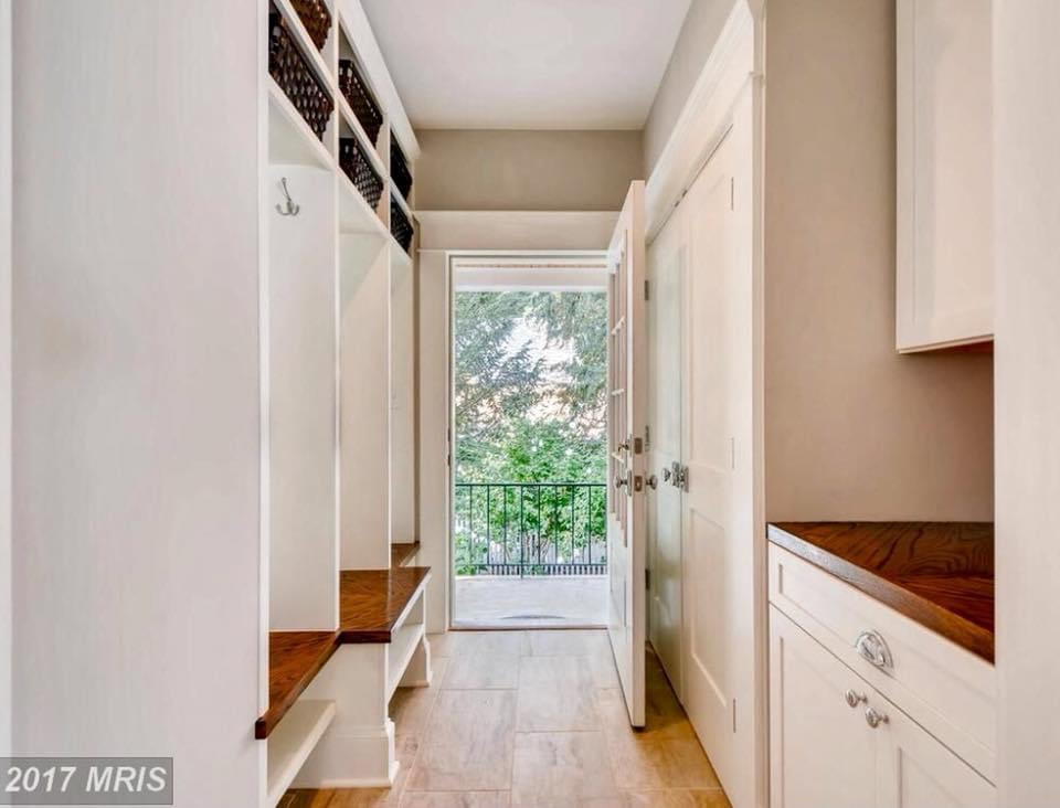 Inspiration for a small traditional mudroom in Baltimore with grey walls, porcelain floors, a single front door, a white front door, beige floor and wood walls.