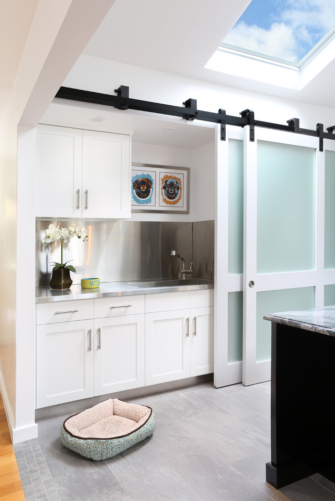 Example of a mid-sized classic single-wall eat-in kitchen design in Other with recessed-panel cabinets, white cabinets and an island