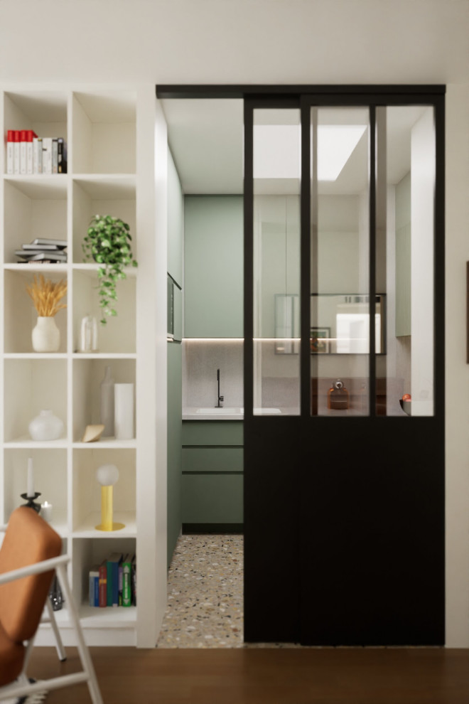 Design ideas for a mid-sized contemporary u-shaped separate kitchen in Paris with flat-panel cabinets, green cabinets, no island, an undermount sink, brown splashback, timber splashback, panelled appliances, terrazzo floors and multi-coloured floor.