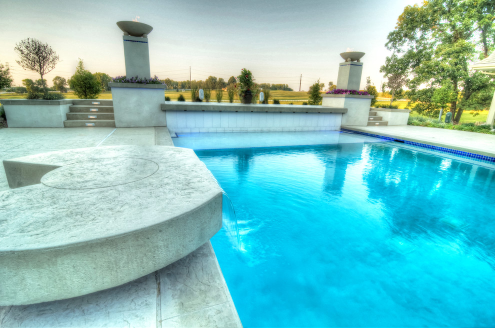 Hot tub - large transitional backyard concrete paver and rectangular natural hot tub idea in Cedar Rapids