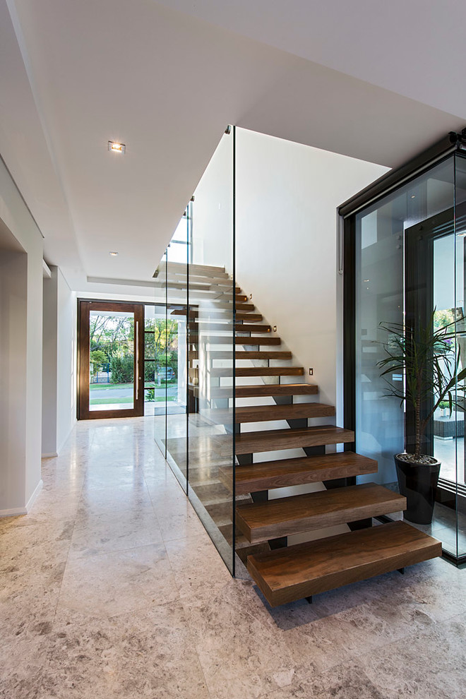 This is an example of a contemporary wood straight staircase in Perth with open risers.