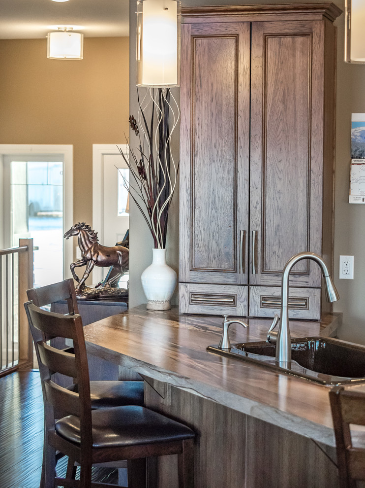 Example of a transitional kitchen design in Calgary