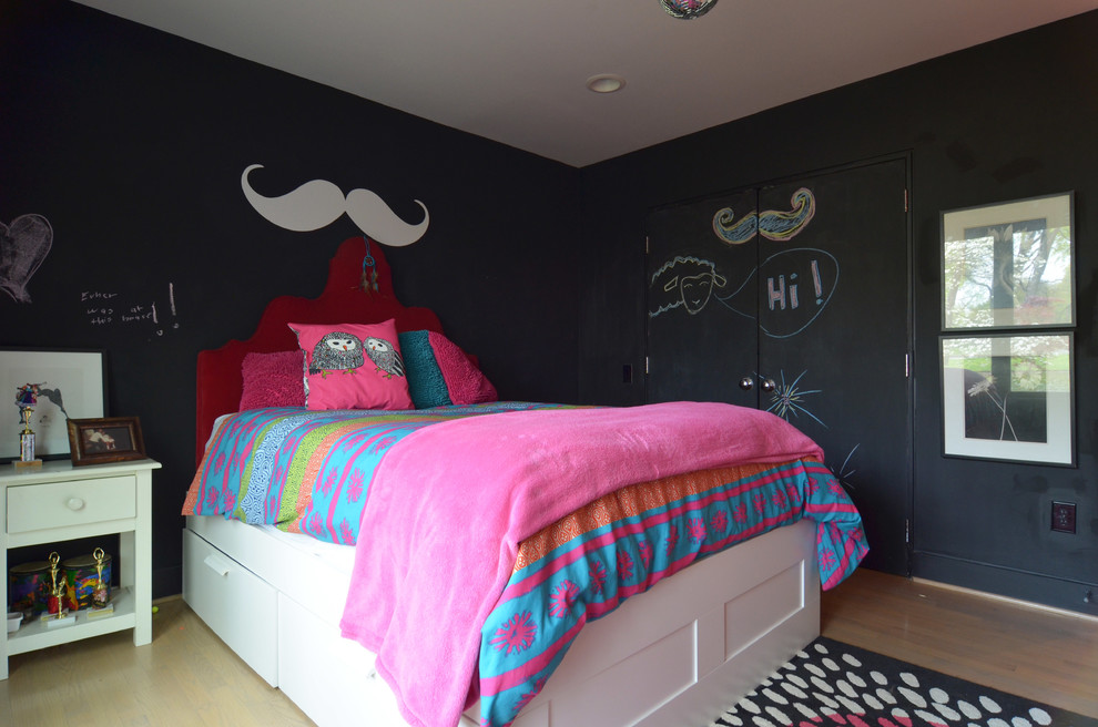 Transitional kids' room in Dallas with black walls and light hardwood floors for girls.