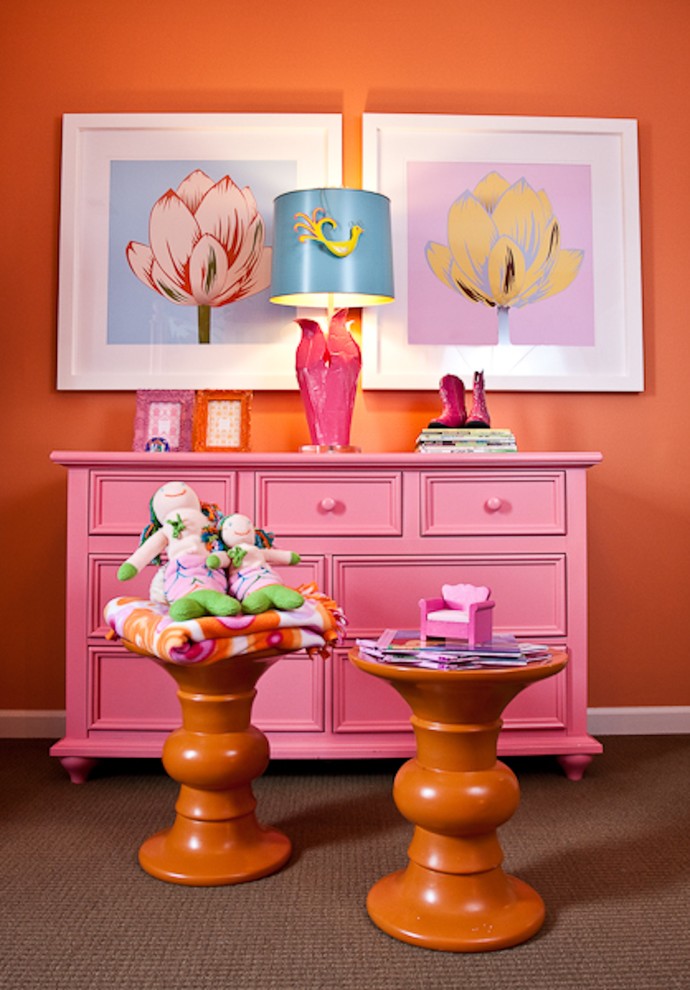 Photo of an eclectic kids' bedroom for girls in Nashville with orange walls and carpet.