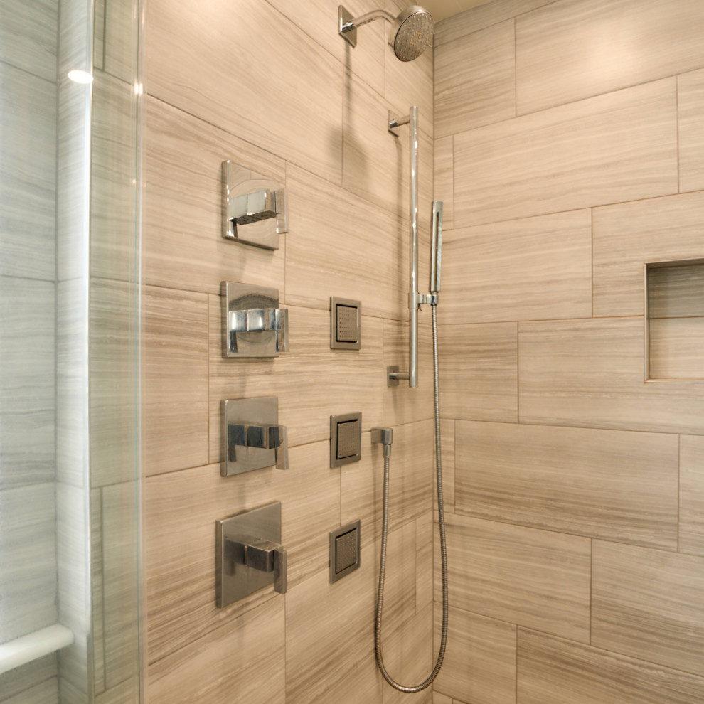 Inspiration for a medium sized modern ensuite bathroom in Philadelphia with flat-panel cabinets, grey tiles, grey walls, grey floors, a hinged door, white worktops, double sinks, grey cabinets, a two-piece toilet, ceramic tiles, lino flooring, a built-in sink, limestone worktops, a shower bench and a built in vanity unit.