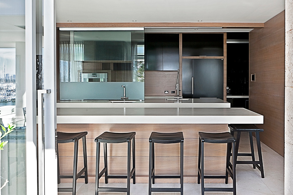 Contemporary open plan kitchen in Perth with an undermount sink, flat-panel cabinets, brown splashback, timber splashback, panelled appliances and with island.