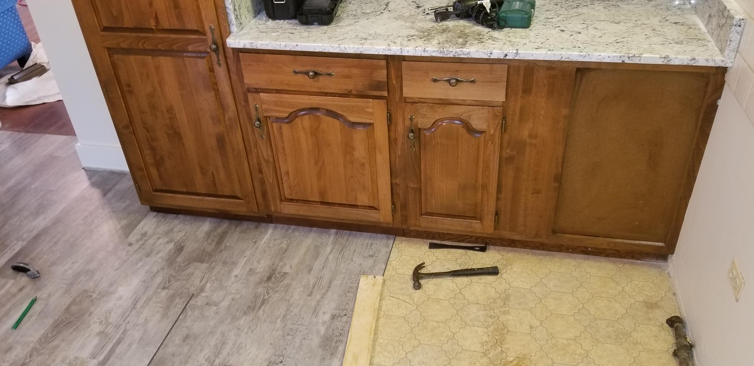 New vinyl plank flooring in a summer home kitchen