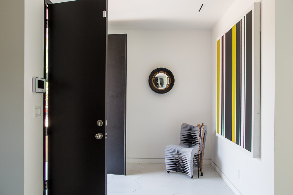 Mid-sized contemporary front door in Los Angeles with white walls, ceramic floors, a double front door, a black front door and white floor.