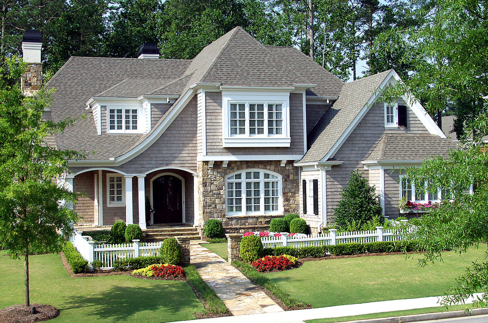 Inspiration for a large transitional two-storey grey exterior in Atlanta with wood siding.