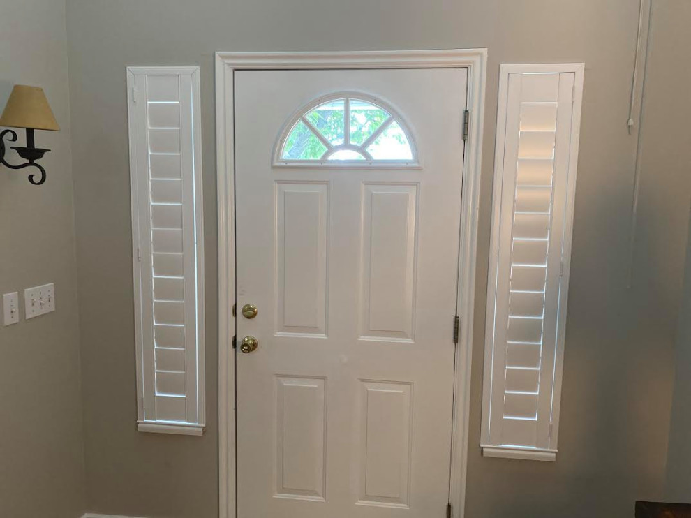 This is an example of a small modern foyer in Salt Lake City with grey walls, a single front door and a white front door.
