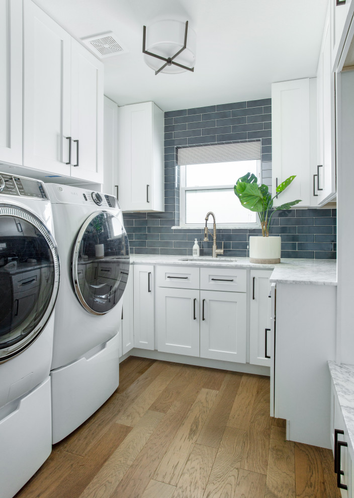 Design ideas for a transitional laundry room in Dallas.