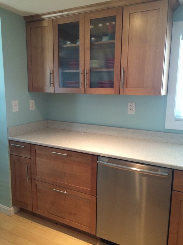 Transitional galley light wood floor eat-in kitchen photo in Boston with an undermount sink, shaker cabinets, medium tone wood cabinets, quartz countertops, stainless steel appliances, no island and white countertops