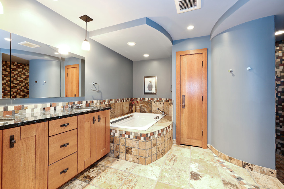 Photo of a large midcentury master wet room bathroom in Chicago with medium wood cabinets, an undermount tub, multi-coloured tile, mosaic tile, blue walls, ceramic floors, a drop-in sink, granite benchtops, multi-coloured floor, flat-panel cabinets, grey benchtops, a double vanity, a built-in vanity, a one-piece toilet, an open shower, wallpaper and wallpaper.