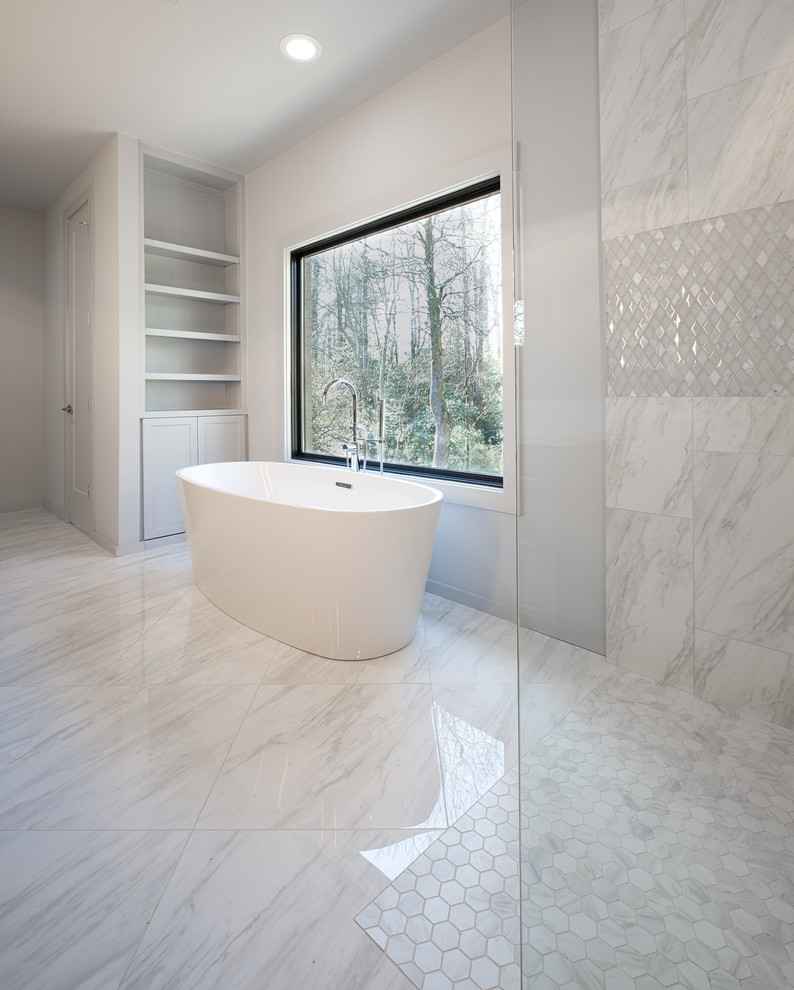 Inspiration for a mid-sized modern master bathroom in Other with shaker cabinets, grey cabinets, a freestanding tub, an open shower, a two-piece toilet, gray tile, marble, grey walls, marble floors, an undermount sink, marble benchtops, grey floor, an open shower and white benchtops.