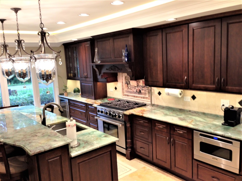 Inspiration for a mid-sized transitional travertine floor and beige floor eat-in kitchen remodel in Chicago with a double-bowl sink, raised-panel cabinets, dark wood cabinets, quartzite countertops, beige backsplash, stone tile backsplash, stainless steel appliances and an island