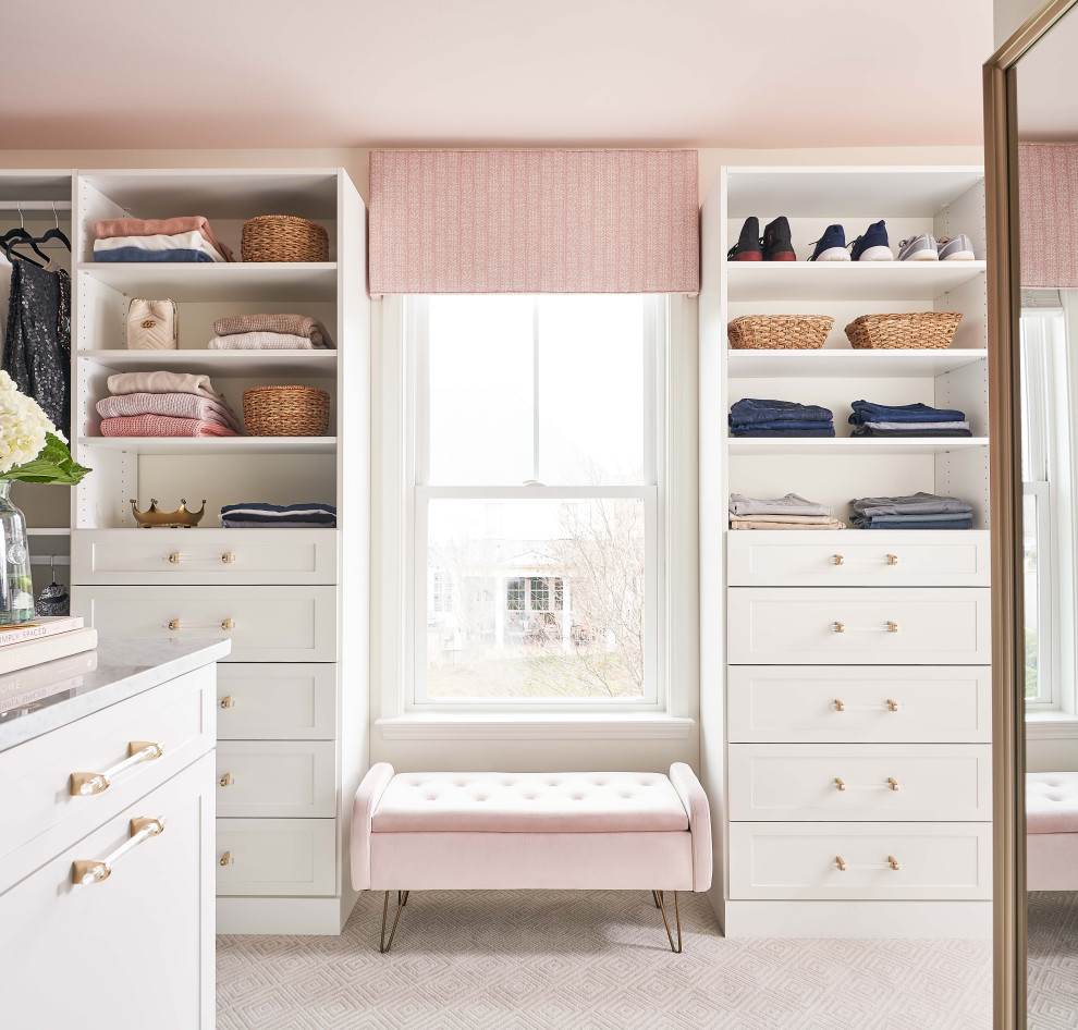 Inspiration for a large beach style gender-neutral walk-in wardrobe in Charlotte with shaker cabinets, white cabinets, carpet and beige floor.