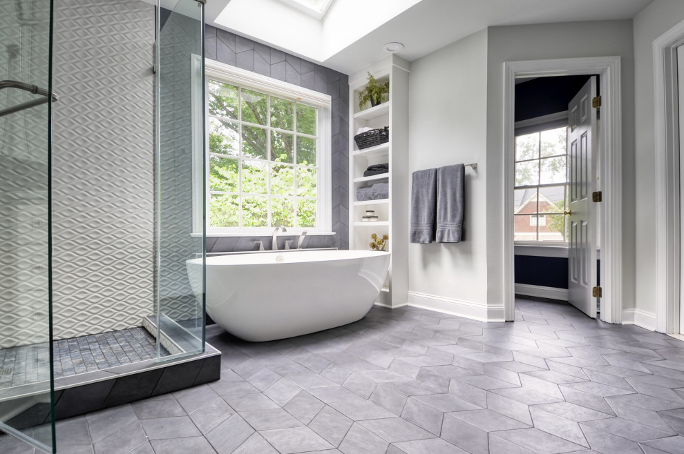 Mid-sized modern master bathroom in DC Metro with recessed-panel cabinets, white cabinets, a freestanding tub, a corner shower, a two-piece toilet, white tile, ceramic tile, blue walls, cement tiles, an undermount sink, marble benchtops, grey floor, a hinged shower door and white benchtops.
