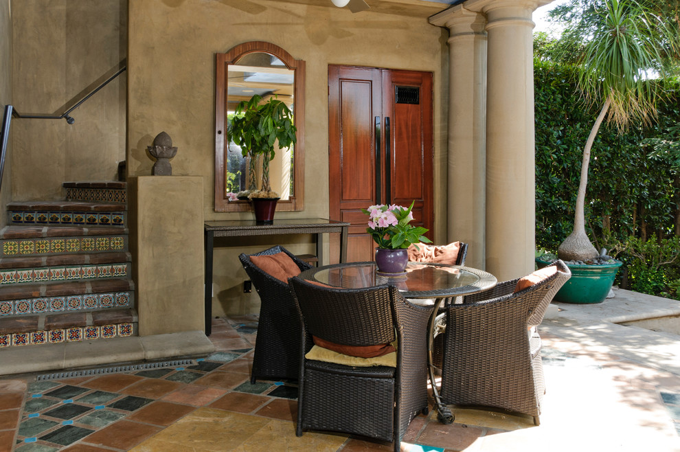 Design ideas for a mediterranean patio in Los Angeles with tile.