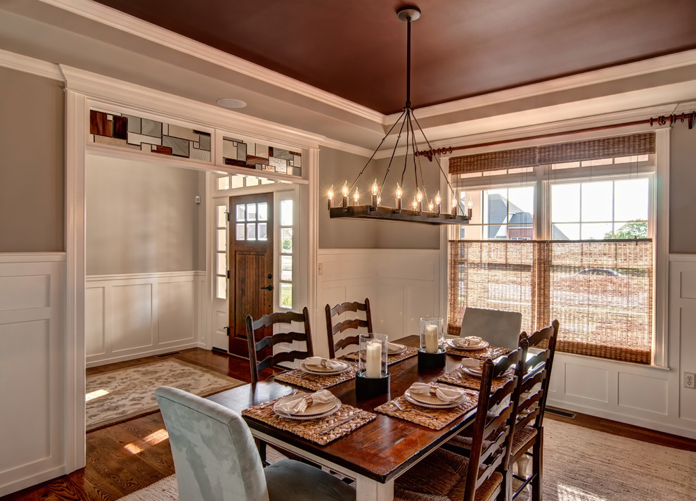 Design ideas for a traditional dining room in Other with grey walls.