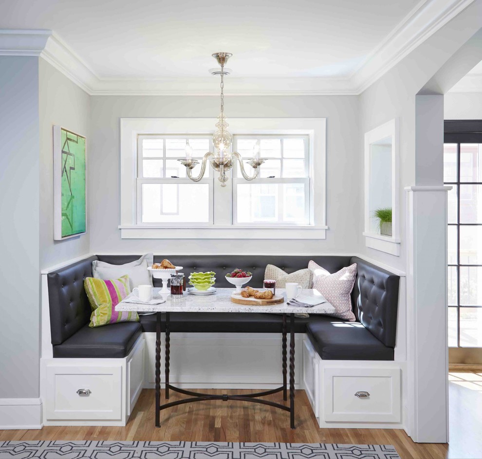 Example of a transitional medium tone wood floor and brown floor dining room design in DC Metro with gray walls