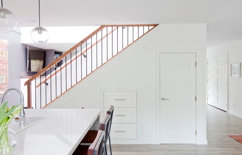 Design ideas for a mid-sized transitional straight staircase in Vancouver.