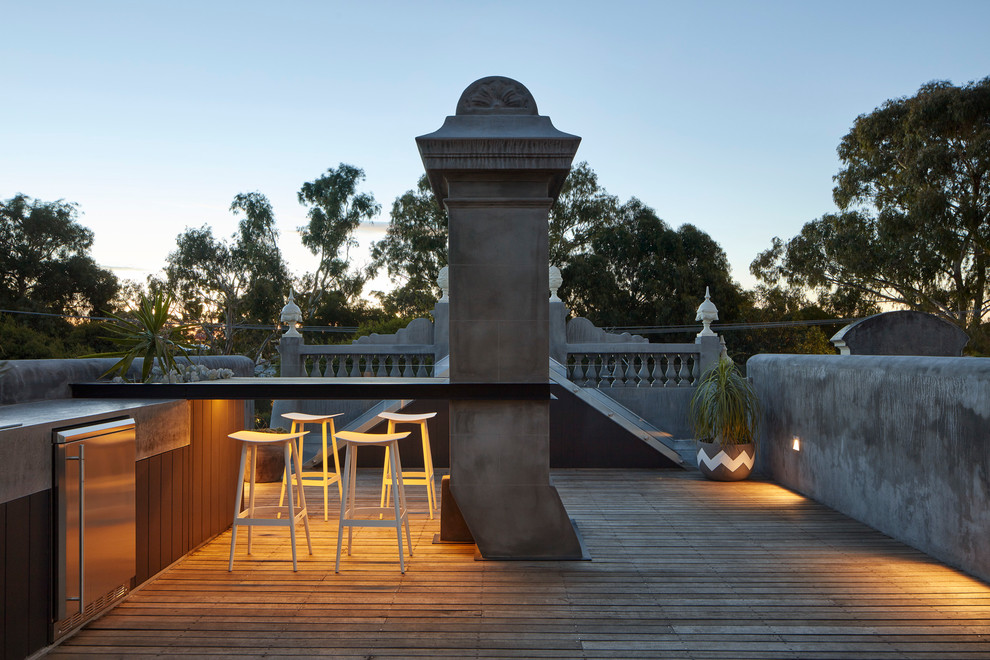 Small contemporary rooftop deck in Melbourne with an outdoor kitchen and no cover.