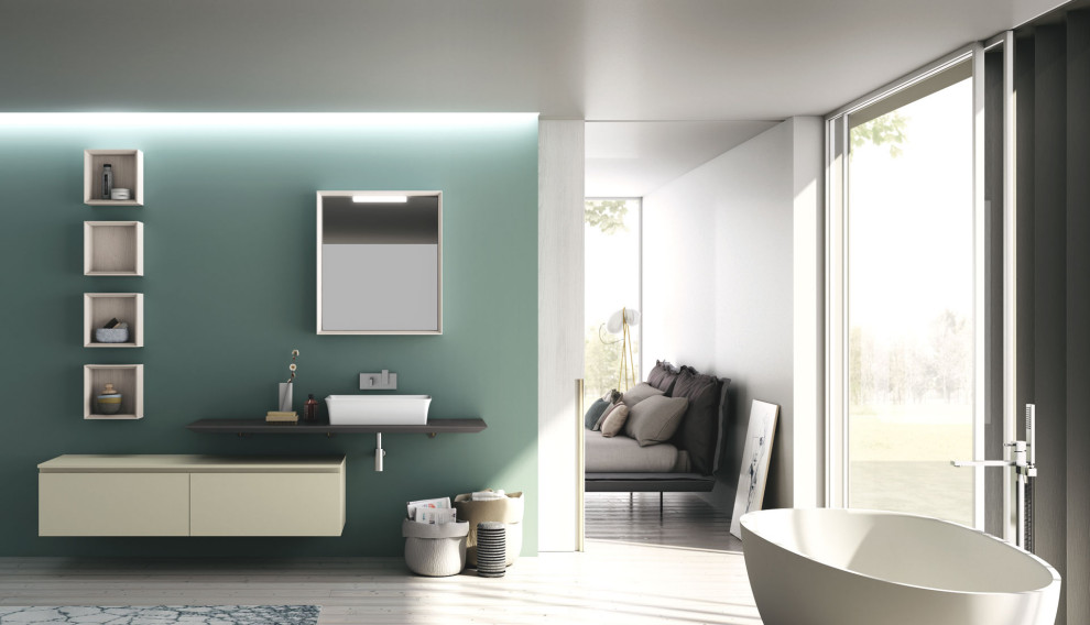 Пример оригинального дизайна: главная ванная комната среднего размера в стиле модернизм с плоскими фасадами, белыми фасадами, отдельно стоящей ванной, зеленой плиткой, светлым паркетным полом, настольной раковиной, серой столешницей и подвесной тумбой