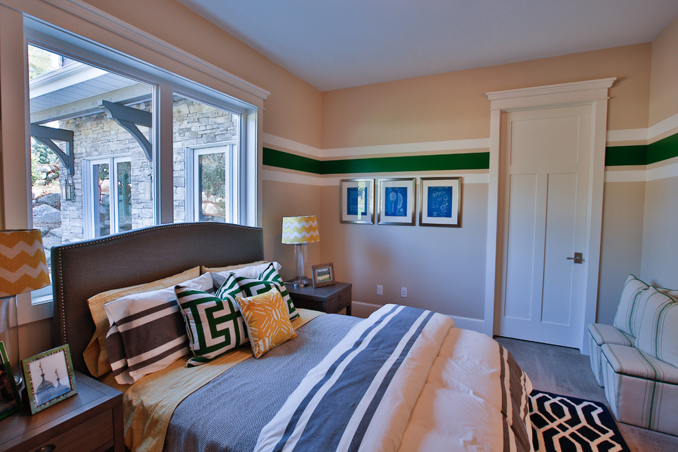 Photo of a large transitional gender-neutral kids' room in Salt Lake City with multi-coloured walls and carpet.