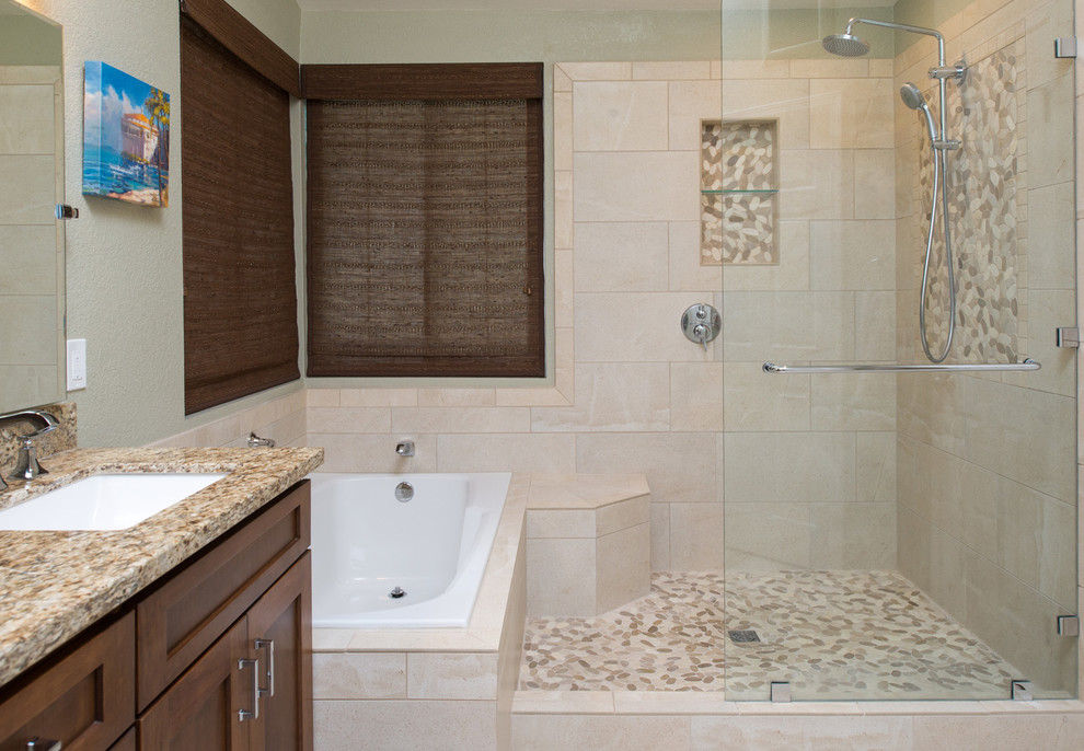 Design ideas for a mid-sized traditional master bathroom in San Diego with an undermount sink, raised-panel cabinets, medium wood cabinets, granite benchtops, a drop-in tub, an open shower, a one-piece toilet, beige tile, ceramic tile, beige walls and ceramic floors.