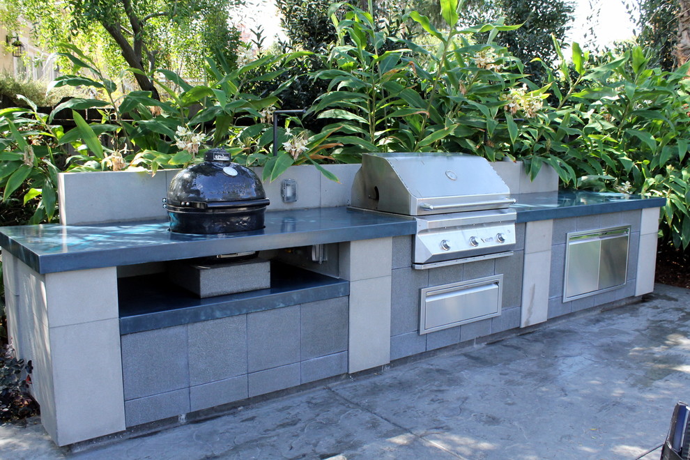 Photo of an expansive modern backyard patio in San Francisco with an outdoor kitchen, no cover and stamped concrete.