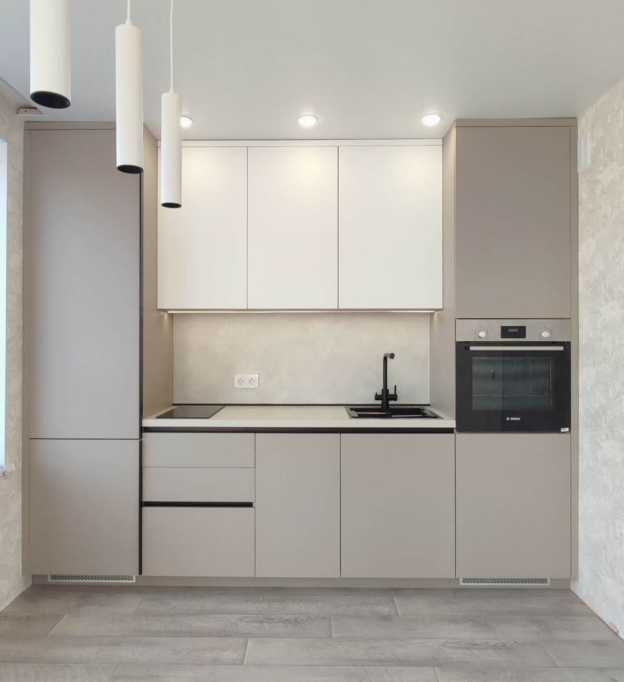 Design ideas for a small contemporary grey and white single-wall enclosed kitchen in Novosibirsk with a built-in sink, flat-panel cabinets, white cabinets, wood worktops, beige splashback, wood splashback, black appliances, laminate floors, no island, grey floors and beige worktops.