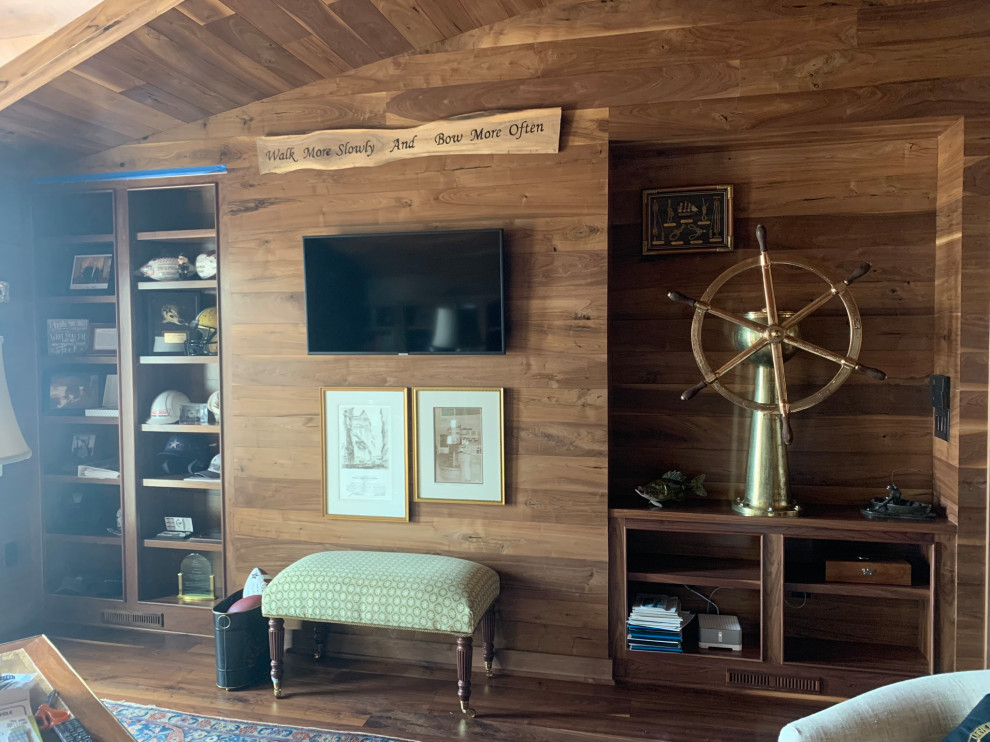 Photo of a large beach style study room in Charleston with brown walls, dark hardwood floors, a freestanding desk, timber and planked wall panelling.